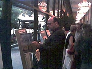 Gala attendee inspects "Rocketdyne Ranch" expose on display in main hall.